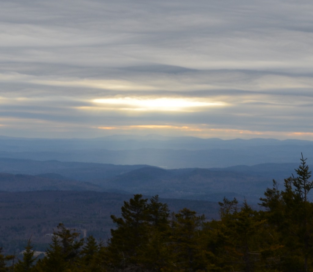 Look around on your hike and you may catch the sun breaking through the clouds, seen from Monadnock's White Dot Trail. 04.18.13. Photo by Patrick Hummel