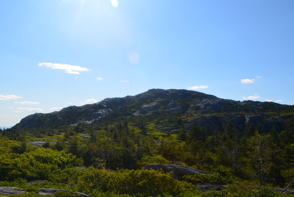 The midday sun shines broughtly upon the summit of Grand Monadnock. 06.19.13. Photo by Patrick Hummel.