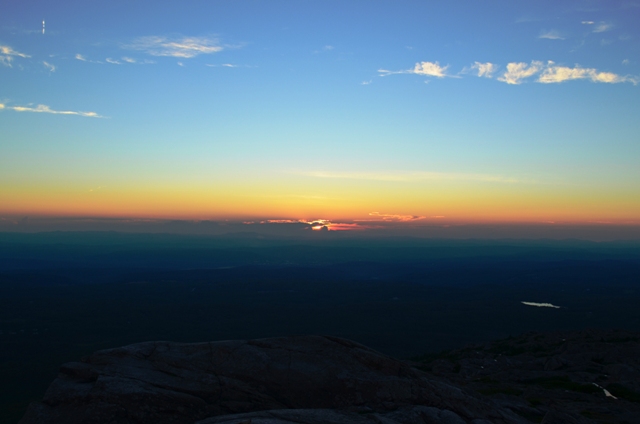 The sun sets over the Green Mountains of Vermont, viewed from Monadnock. 07.23.13. Photo by Patrick Hummel.