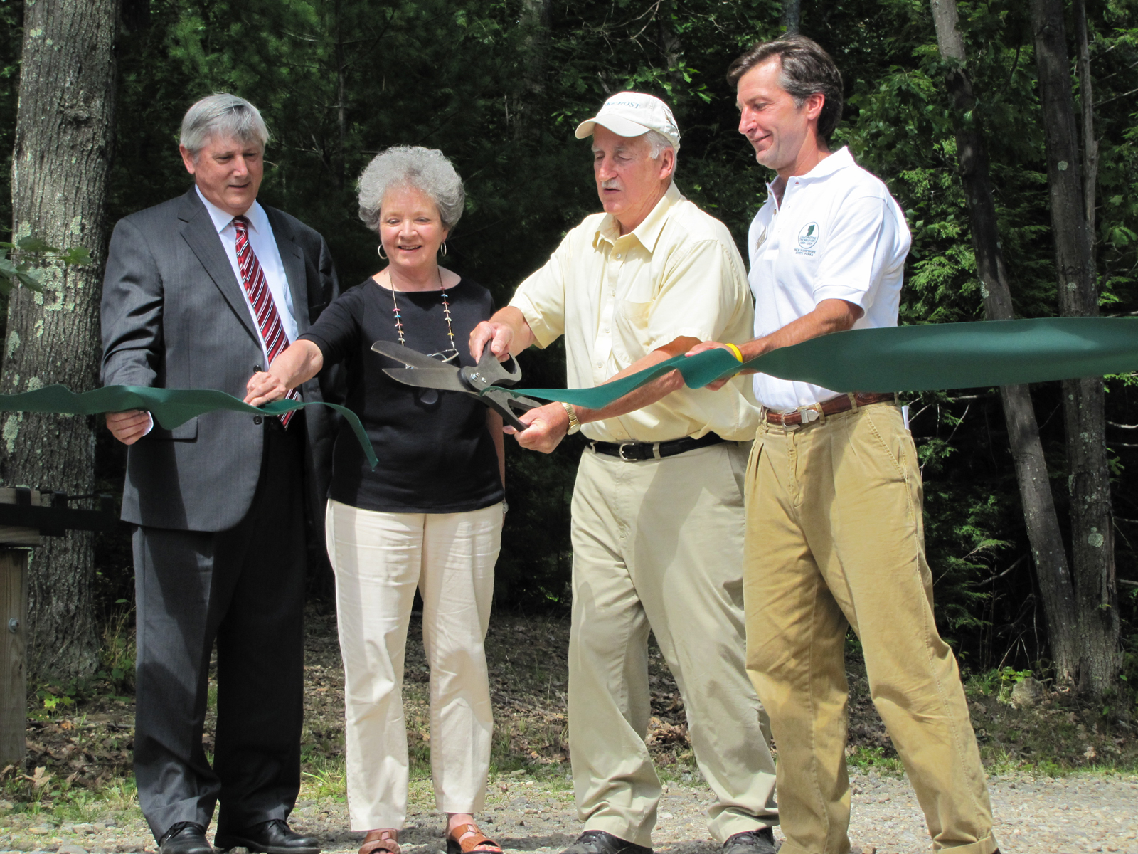DRED Commissioner George Bald, Ann and Charlie Royce, and NH State Parks Director Ted Austin at the ribbon cutting for Gilson Pond Campground. Photo courtesy of NH State Parks. 