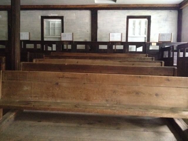 View of the benches and box pews inside.