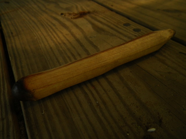 The spindle is a drill carved from cedar. This is what drills into the fireboard