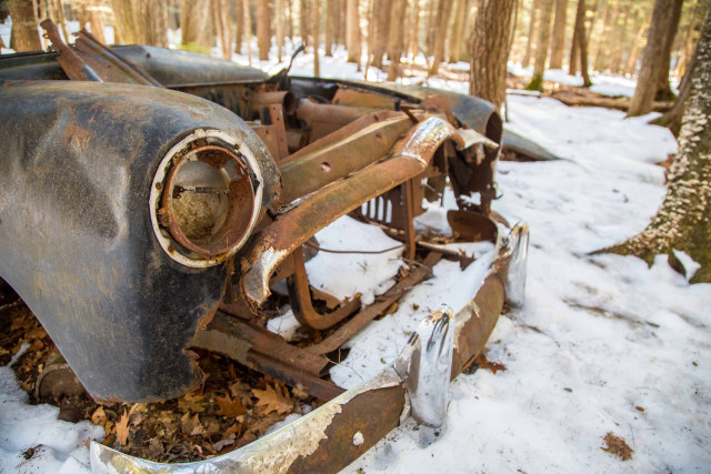 old automobile relic just off the trail